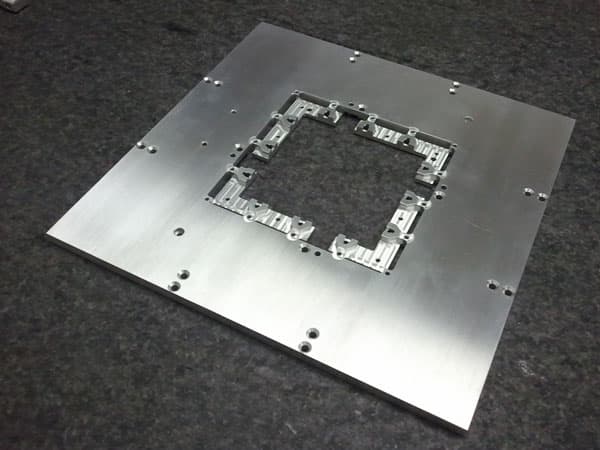 Large aluminum fixture with a detailed machined center
