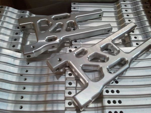 A production run of machined aluminum plates
